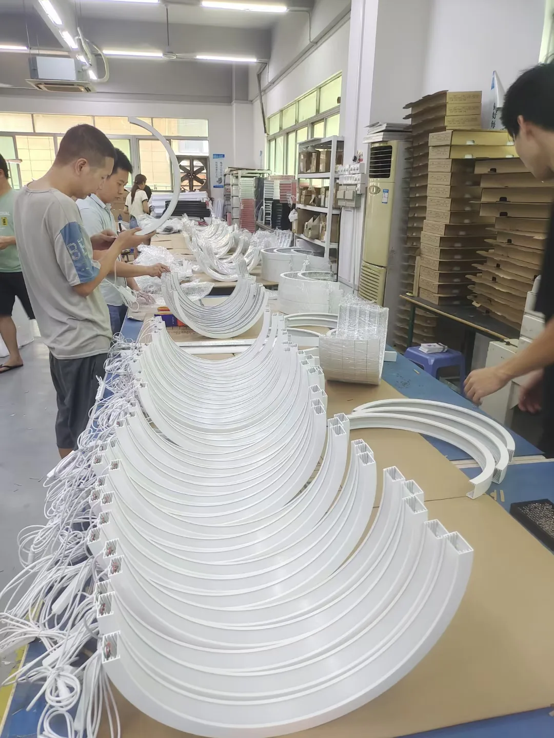 Worker assembling a beauty lamp housing